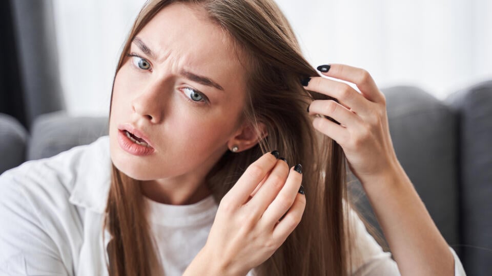 Surprised,Nervous,Woman,Notices,With,Shocked,Emotions,That,Her,Hair