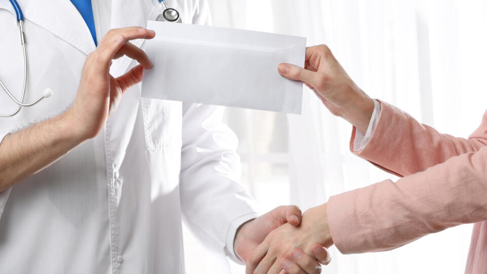 Doctor,Taking,Bribe,From,Woman,Hand,Closeup
