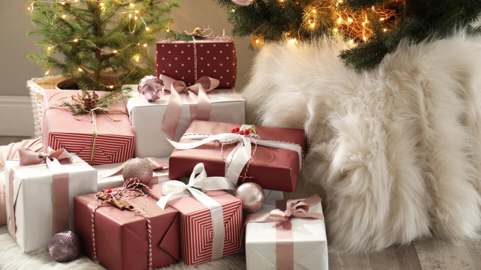 Gift,Boxes,Under,Small,And,Big,Christmas,Trees,Indoors