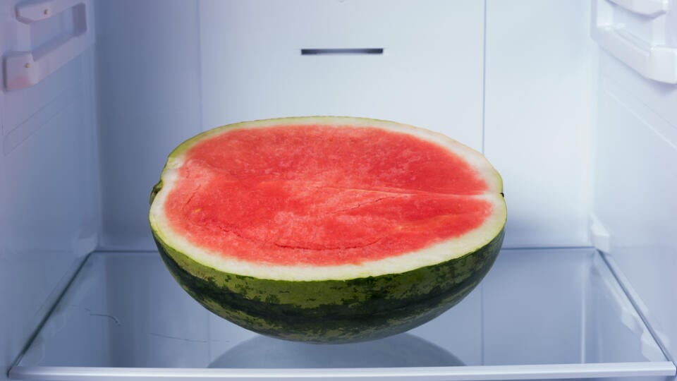 Half,Of,Watermelon,In,Refrigerator.