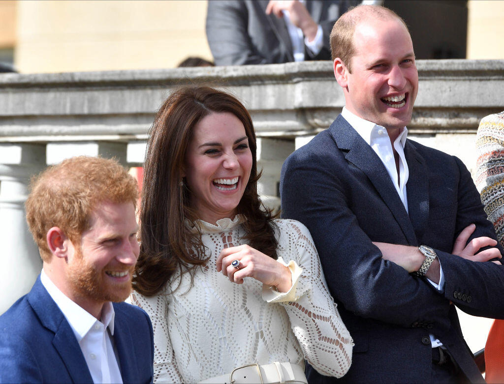LONDON, UNITED KINGDOM - MAY 13: Prince Harry, Catherine, Duchess of Cambridge and Prince William, Duke of Cambridge laugh as they host a tea party in the grounds of Buckingham Palace to honour the children of those who have died serving in the armed forces on May 13, 2017 in London, England. (Photo by Andrew Parsons - WPA Pool/Getty Images)