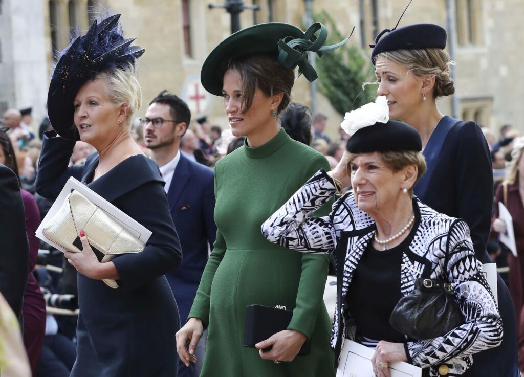 Pippa Matthews, center, leaves after the wedding of Princess Eugenie of York and Jack Brooksbank at St George’s Chapel, Windsor Castle, near London, England, Friday Oct. 12, 2018. (Gareth Fuller/Pool via AP)