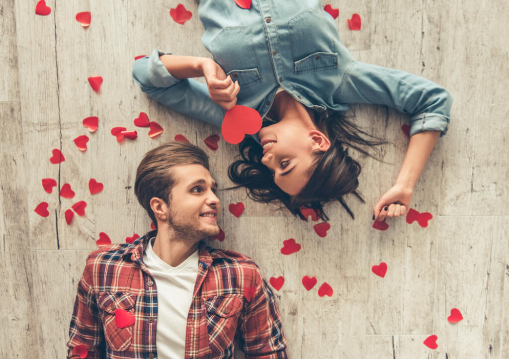 Top,View,Of,Happy,Young,Couple,Looking,At,Each,Other