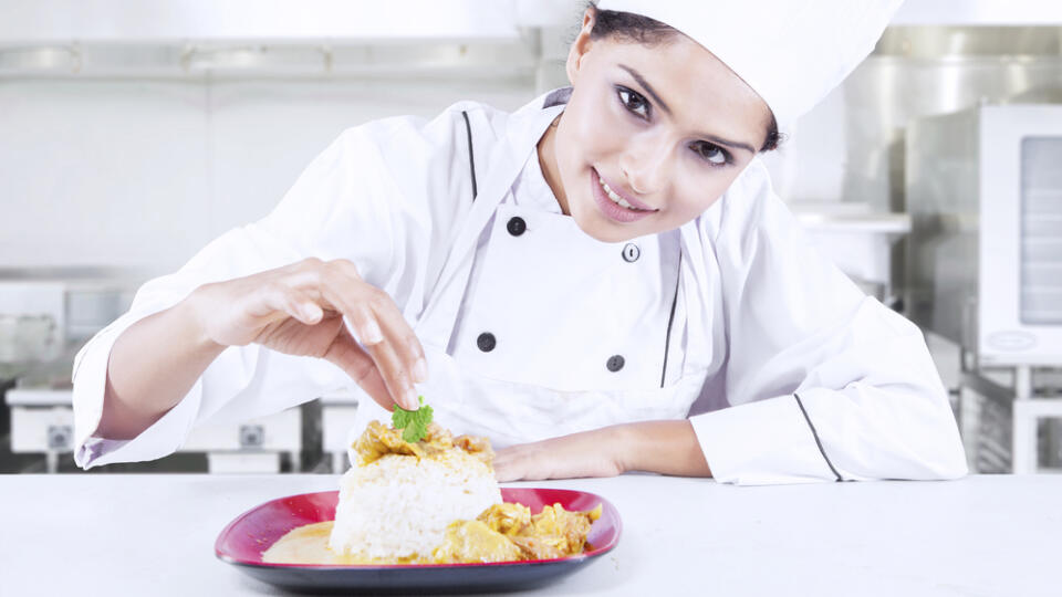 Portrait,Of,A,Beautiful,Indian,Chef,Preparing,Delicious,Meal,In