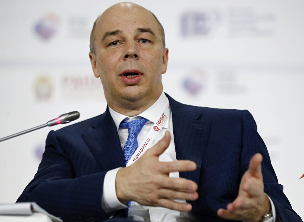 Russia's Finance Minister Anton Siluanov addresses the Gaidar Forum in Moscow, Russia, Wednesday, Jan. 14, 2015. Siluanov said an earlier plan to boost government spending by nearly 12 percent this year is unrealistic, and some of the planned expenditures should be cut. Siluanov has promised to maintain a tight lid on spending as the country faces its worst economic downturn in 15 years.  (AP Photo/Pavel Golovkin)