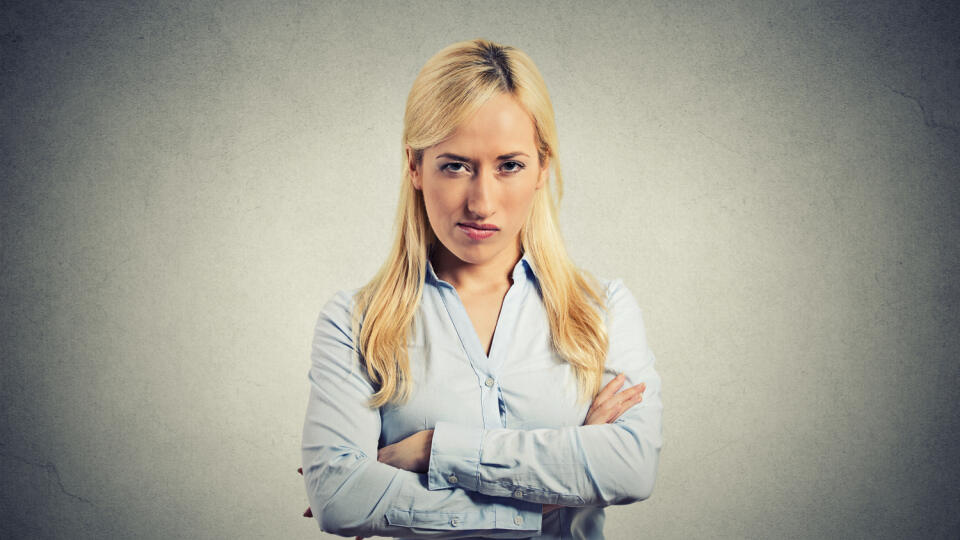 Portrait,Angry,Blonde,Woman,On,Grey,Background