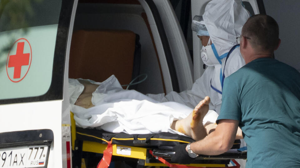 WA 16 Moscow - Paramedics bring a patient with symptoms of COVID -19 to Kommunarka Hospital on the outskirts of Moscow on 21 June 2021.  Russia warned on Wednesday against 