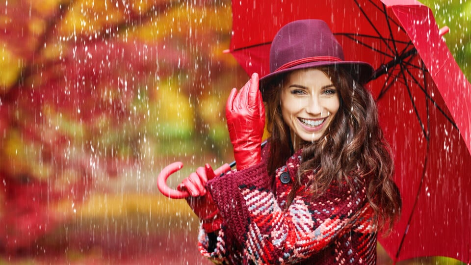 Young,Woman,With,Autumn,Leaves,And,Fall,Yellow,Maple,Garden