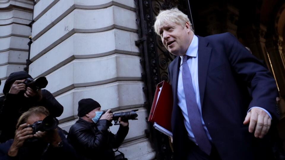 Britain's Prime Minister Boris Johnson returns to Downing Street after attending a Cabinet meeting in London, Tuesday, Oct. 20, 2020.