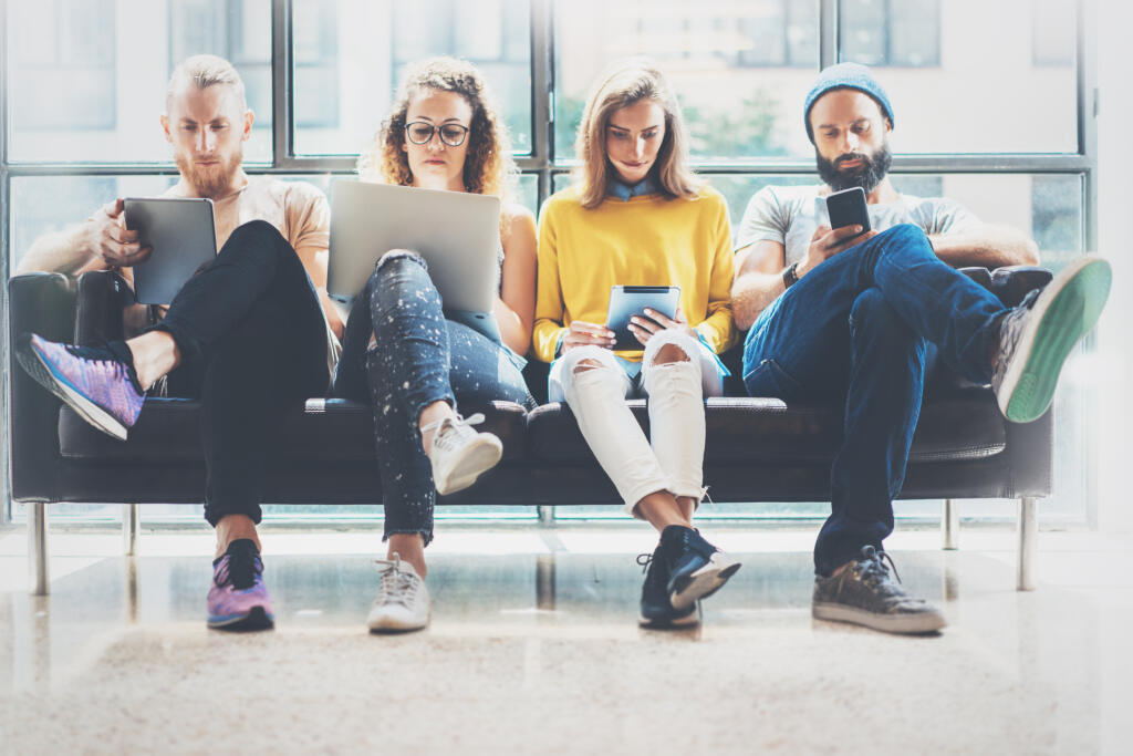 Group,Adult,Hipsters,Friends,Sitting,Sofa,Using,Modern,Gadgets.business,Startup