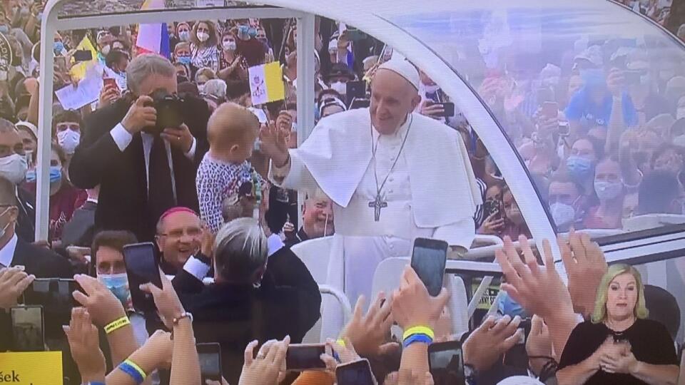 The pope made an unexpected touching gesture in the crowd.  He lifted the little boy from the crowd to his hands and kissed him on the forehead.