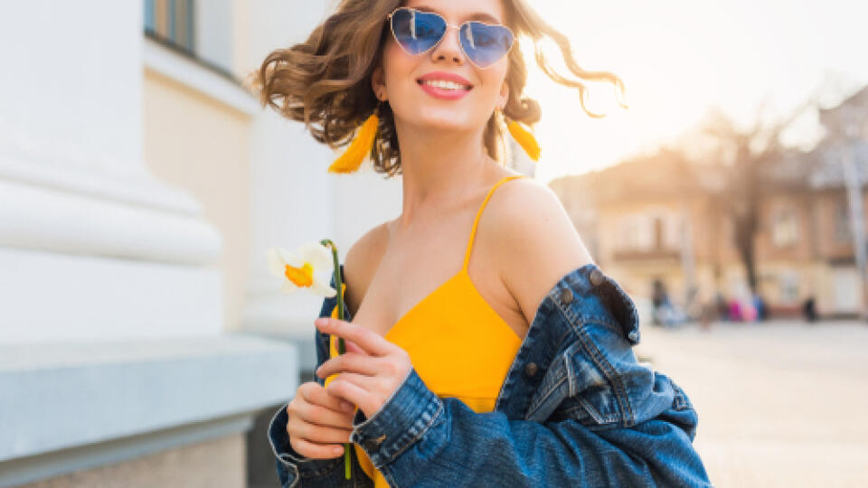 Beautiful,Woman,Waving,Hair,Smiling,,Stylish,Apparel,,Wearing,Denim,Jacket