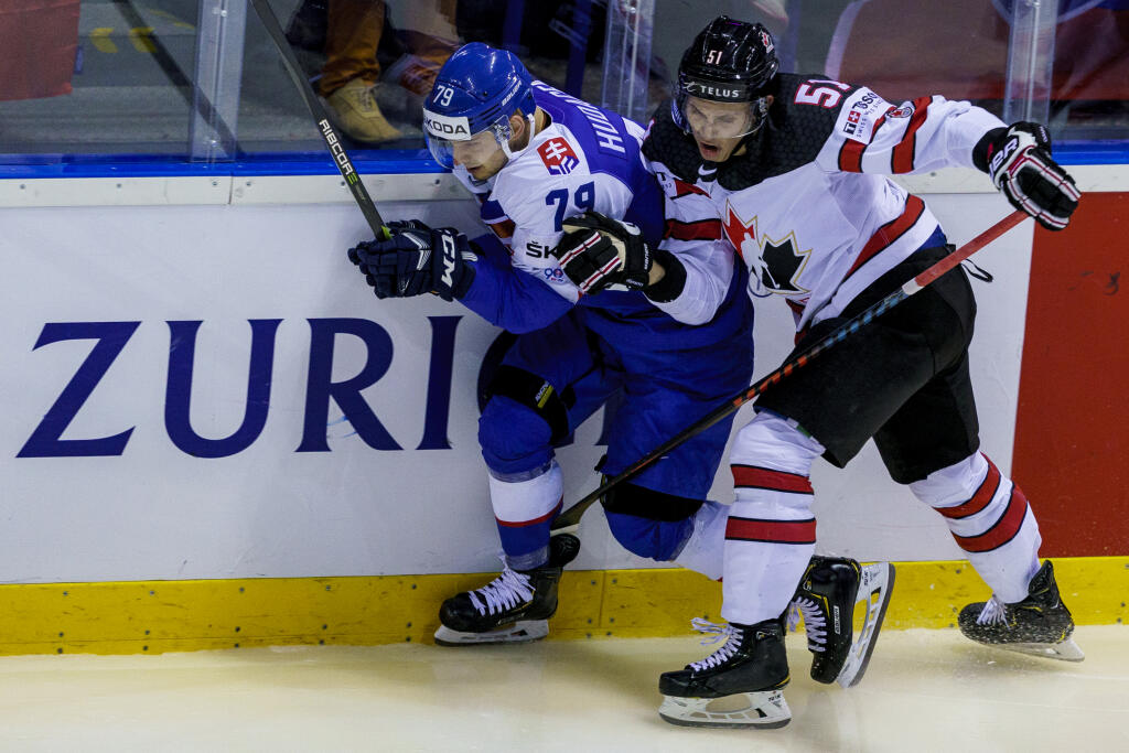 Na snímke Libor Hudáček a Troy Stecher počas zápasu A skupiny hokejových Majstrovstiev sveta IIHF 2019 medzi reprezentáciami Slovenska a Kanady.