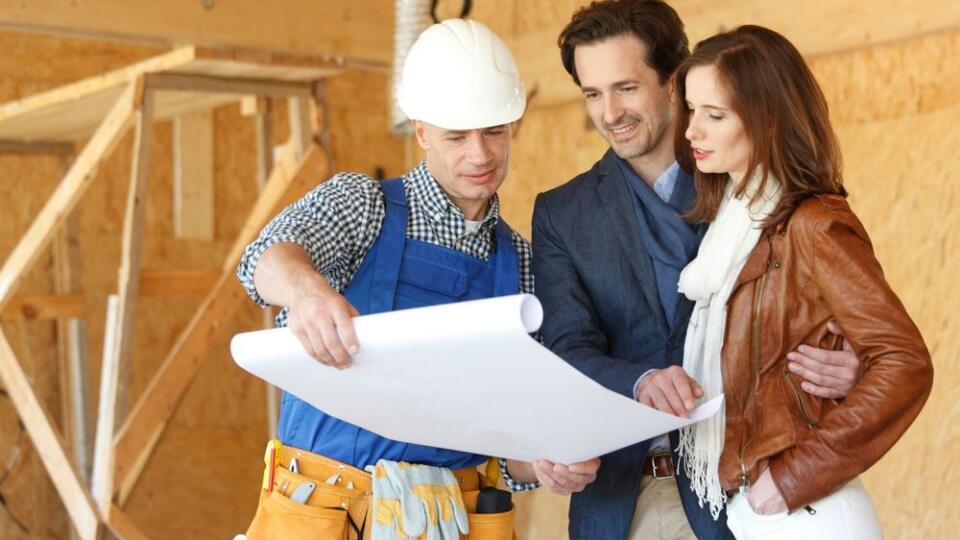 Worker shows house design plans 