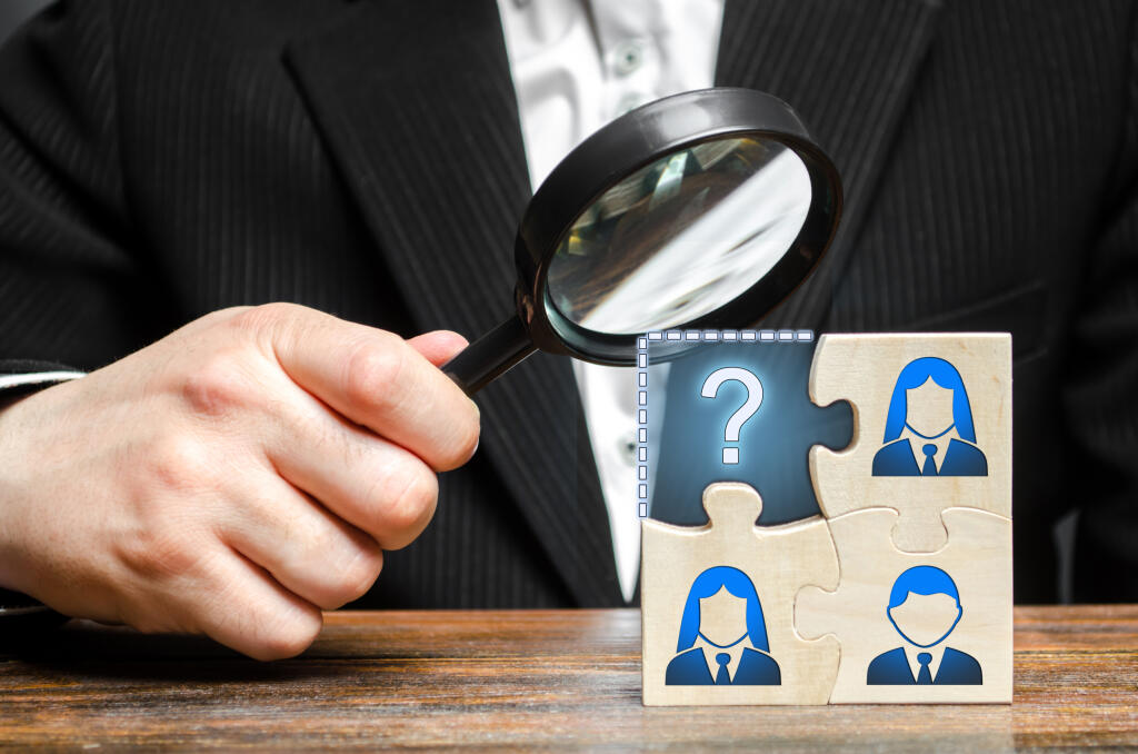 Businessman,With,A,Magnifying,Glass,Examines,The,Missing,Part,Of