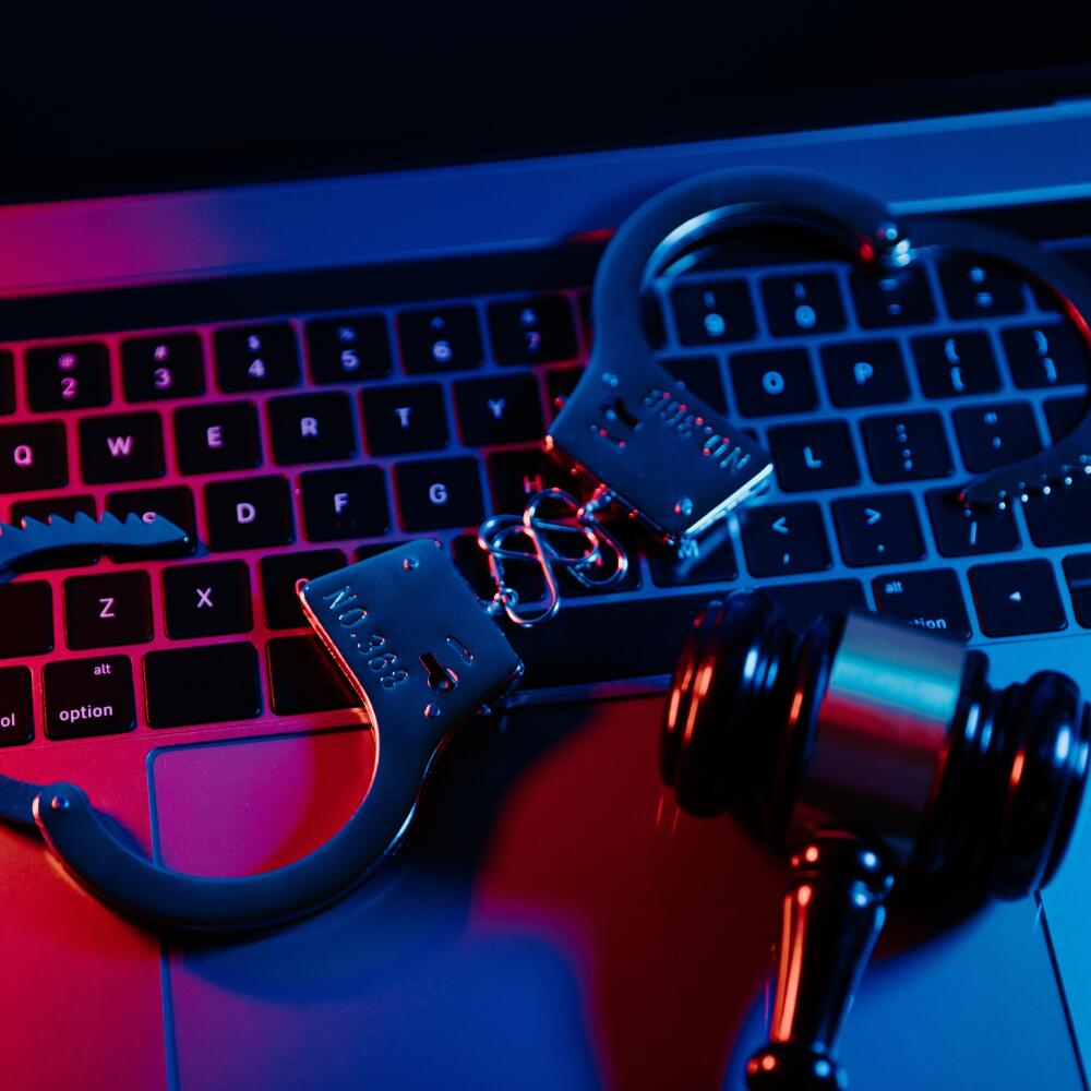 Handcuffs,And,Gavel,On,A,Laptop.,Cyber,Crime,,Online,Piracy