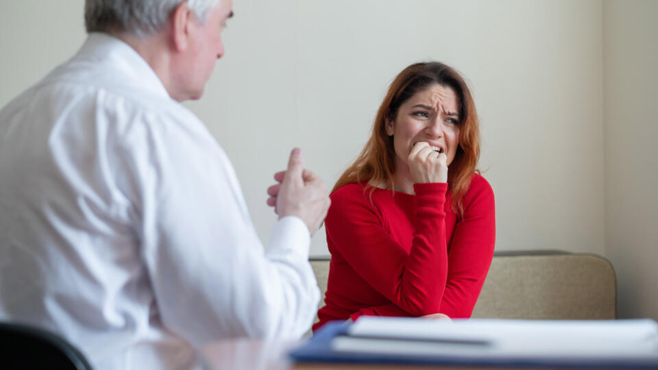 An,Upset,Woman,Bites,Her,Nails,At,A,Session,With