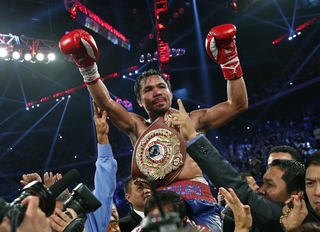 EBE 13 Macao - Filipínsky boxer Manny Pacquiao (na snímke) zaznamenal víťazný návrat do ringu po tamer ročnej prestávke. V dueli v kasíne v Macau v nedeľu 24. novembra 2013 zdolal Američana Brandona Riosa po jednomyseľnom verdikte rozhodcov a získal titul vo welterovej váhe medzinárodnej organizácie WBO.