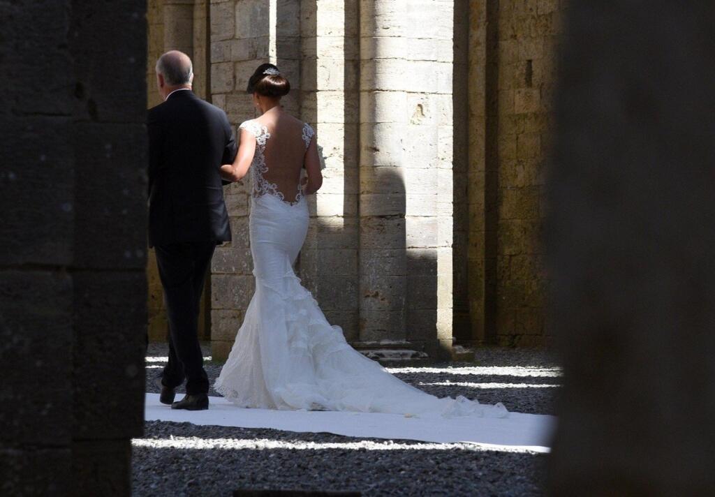 Minttu Virtanen (R) enters in the Abbey of San Galgano, a Cistercian monastery between the towns of Chiusdino and Monticiano, in the province of Siena, Region Tuscany, Italy, 07 August 2016. Finnish Formula One driver Kimi Raikkonen celebrated his wedding with Minttu Virtanen in Italy., Image: 296414668, License: Rights-managed, Restrictions: , Model Release: no, Credit line: Profimedia, TEMP EPA