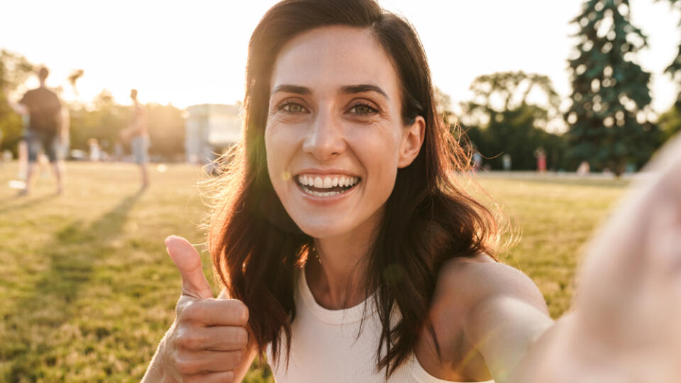 Image,Of,Cheery,Middle-aged,Woman,Showing,Thumb,Up,And,Taking