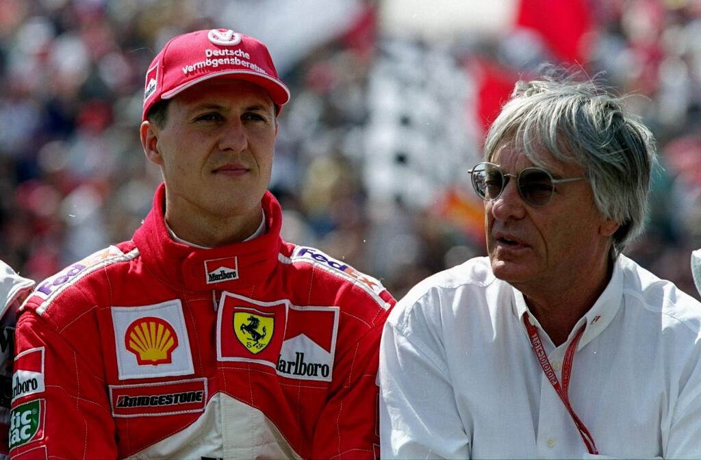13 Aug 2000: Ferrari driver Michael Schumacher with Bernie Ecclestone before the Formula One Hungarian Grand Prix at the Hungaroring near Budapest in Hungary. \ Mandatory Credit: Mark Thompson /Allsport