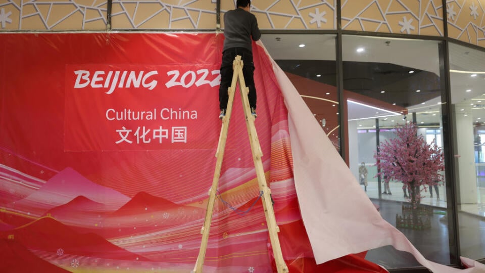 BEIJING, CHINA - DECEMBER 24: A worker wears a protective face mask inside the athletes' village for the Beijing 2022 Winter Olympic Games on December 24, 2021 in Beijing, China. The Beijing Winter Olympics will be held from February 4th to February 20th. (Photo by Emmanuel Wong/Getty Images)