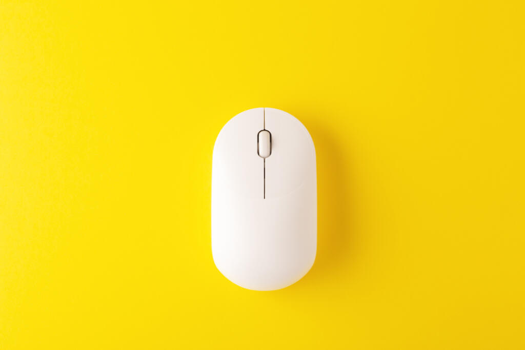 White,Wireless,Mouse,On,Yellow,Background,,Minimal,,Flatlay