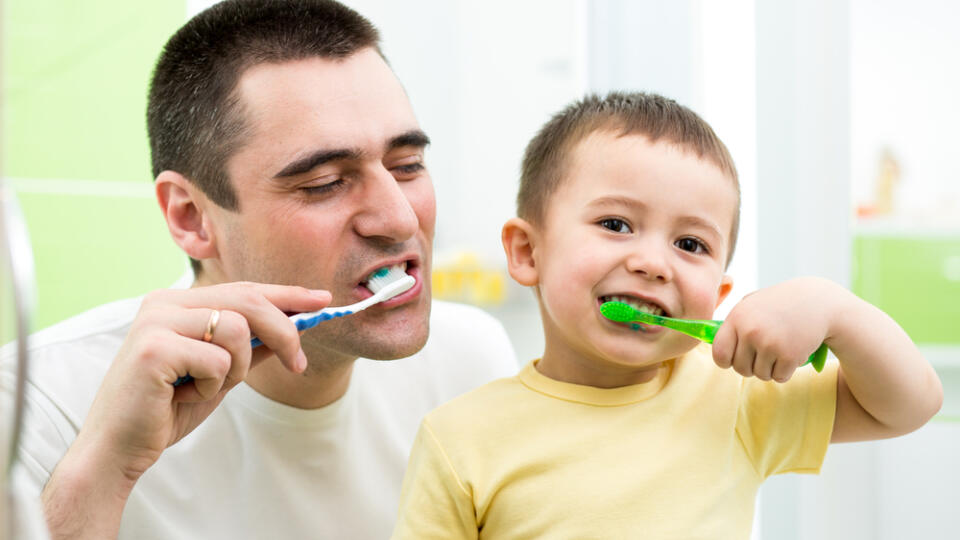 Father,And,Kid,Son,Brushing,Teeth,In,Bathroom