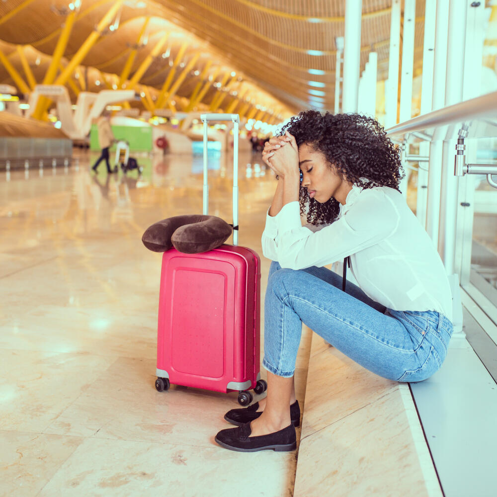 Woman,Sad,And,Unhappy,At,The,Airport,With,Flight,Canceled