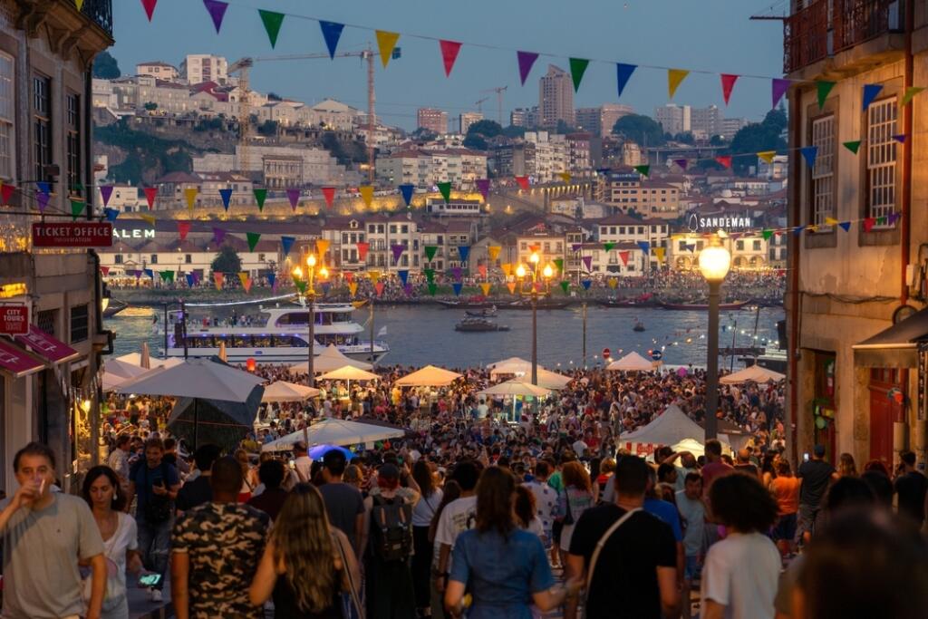 06.23.2023. Porto, Portugal: Festa de Sao Joao do Porton many happy people on the street with plastic hammer on the sao joao festival a funny event in Porto Portugal .