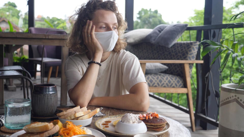 Sad,And,Lonely,Blonde,Woman,In,A,Face,Mask,Sitting