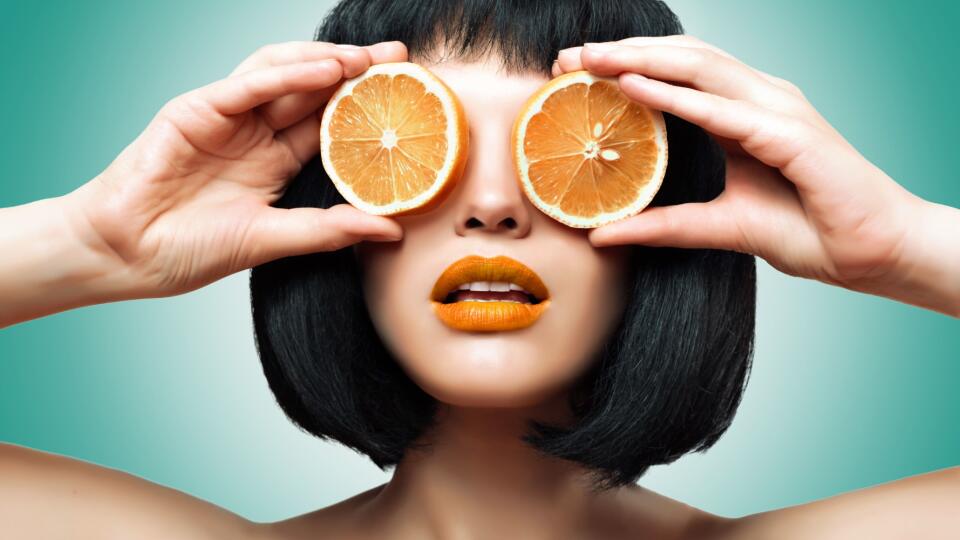Girl with orange. Bright makeup, Ombre.