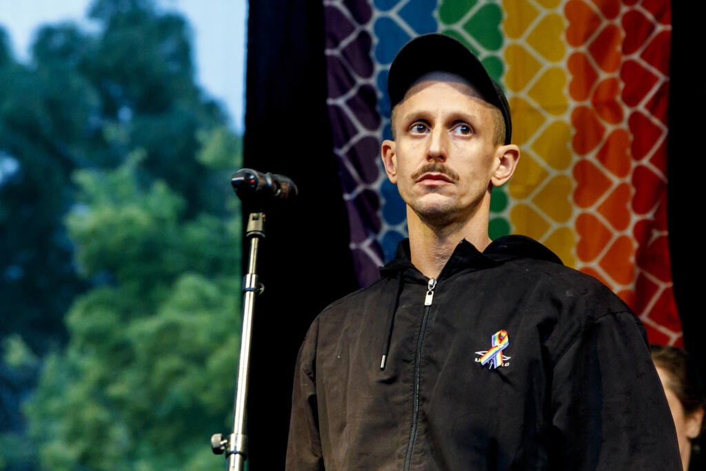 In the picture, the owner of the Tepláreň bar, Roman Samotný, during a speech after the march to condemn hatred towards the LGBTI community in Bratislava on October 14, 2022. The procession from Zámocká Street to SNP Square for the victims of the tragedy was organized by the Initiative Inakosť and Rainbow Pride Bratislava.  TASR PHOTO - Dano Veselský