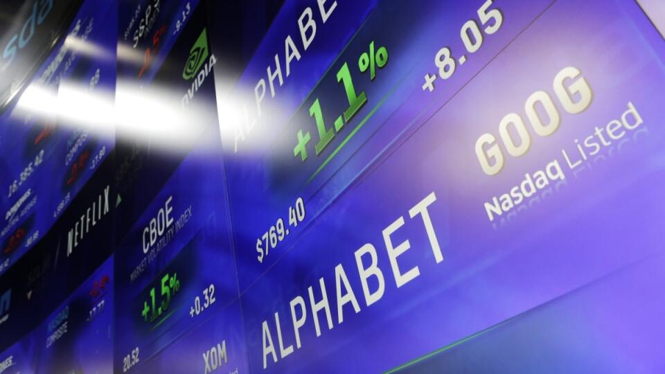 Electronic screens post prices of Alphabet stock, Monday, Feb. 1, 2016, at the Nasdaq MarketSite in New York. Alphabet, the parent company of Google, reports quarterly earnings Monday. (AP Photo/Mark Lennihan)