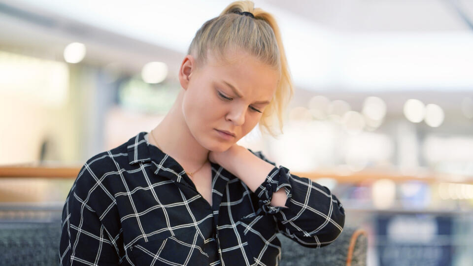 Tired,Neck.,Young,Girl,Suffering,From,Neck,Pain,At,Cafe