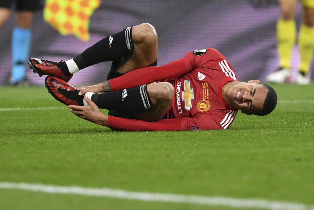 WA 38 archív Gdansk - Na archívnej snímke z 26. mája 2021 futbalista Manchestru United Mason Greenwood leží na trávniku počas finále Ligy majstrov Manchester United - Villarreal v poľskom meste Gdansk. Futbalový krídelník Manchestru United Mason Greenwood dobrovoľne opustil kemp anglickej reprezentácie pred blížiacimi sa majstrovstvami Európy. Dôvodom je pretrvávajúce zranenie, pre ktoré sa nepredstavil ani vo vyraďovacích bojov na kontinentálnom šampionáte do 21 rokov. FOTO TASR/AP
Manchester