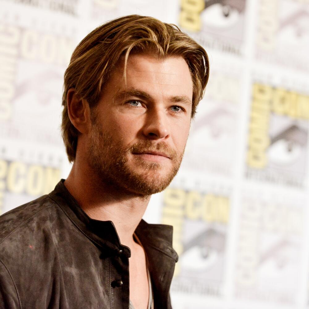 FILE - In this July 26, 2014 file photo, Chris Hemsworth attends the Marvel press line at Comic-Con International in San Diego. People magazine has named Chris Hemsworth the “Sexiest Man Alive” of 2014, cheering the Australian actor’s rise as hammer-wielding, bone fide hunk in the “Thor” films. (Photo by Richard Shotwell/Invision/AP, File)