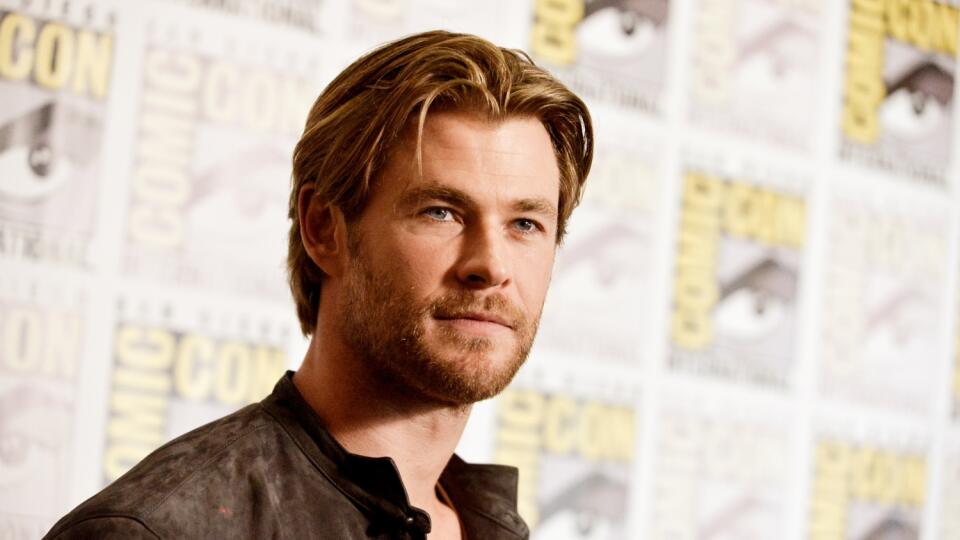 FILE - In this July 26, 2014 file photo, Chris Hemsworth attends the Marvel press line at Comic-Con International in San Diego. People magazine has named Chris Hemsworth the “Sexiest Man Alive” of 2014, cheering the Australian actor’s rise as hammer-wielding, bone fide hunk in the “Thor” films. (Photo by Richard Shotwell/Invision/AP, File)