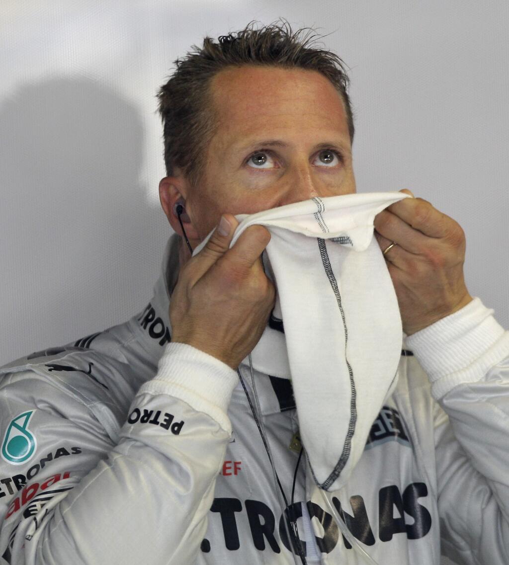 Mercedes Grand Prix driver Michael Schumacher, of Germany, prepares at pits during the first free practice session at the Monza Formula One circuit, in Monza, Italy, Friday, Sept. 7, 2012. The Formula One race will be held on Sunday. (AP Photo/Antonio Calanni)
