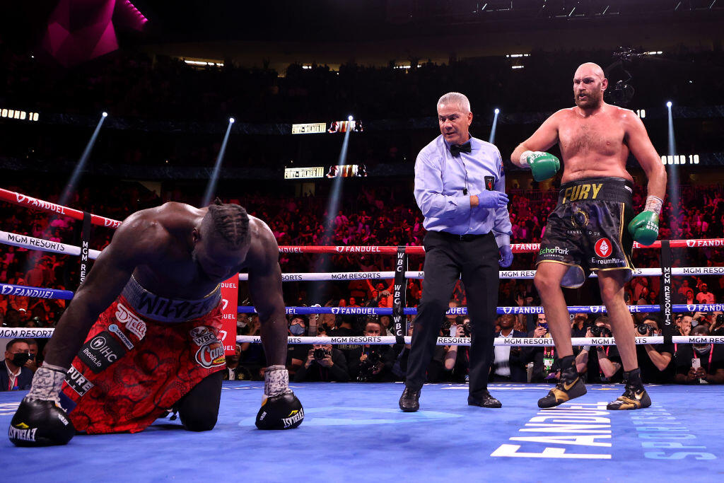 LAS VEGAS, NEVADA - OCTOBER 09: Tyson Fury (R) reacts after knocking down Deontay Wilder during their WBC heavyweight title fight at T-Mobile Arena on October 09, 2021 in Las Vegas, Nevada. (Photo by Al Bello/Getty Images)