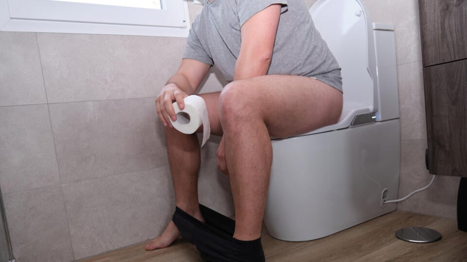 Unrecognizable,Young,Latin,Man,With,Toilet,Paper,On,His,Hand