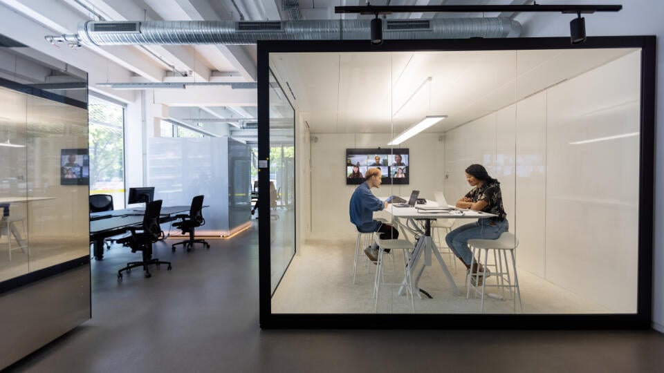 Business people working in hybrid office space
