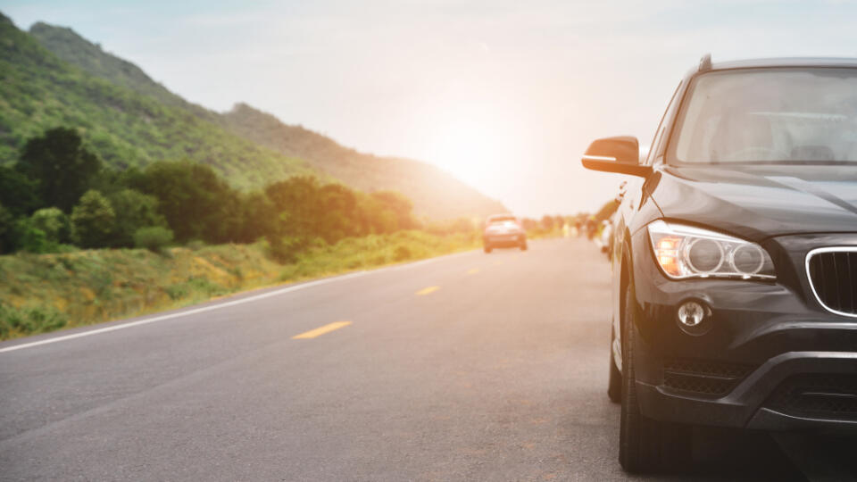 Car,Parked,On,Road,And,Small,Passenger,Car,Seat,On