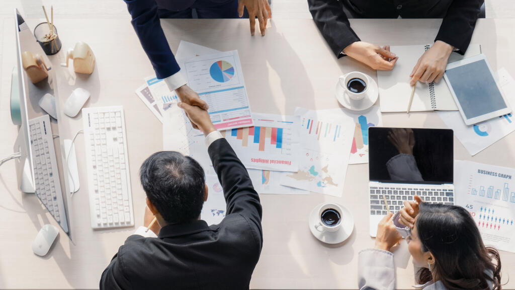 Business,Background,Of,Two,Businessmen,Having,Handshake,Together,After,Geting