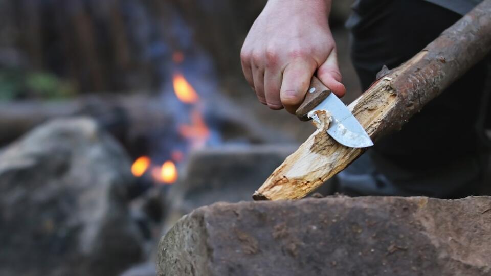 Close,Up,Of,The,Hands,Of,A,Man,Carving,Off