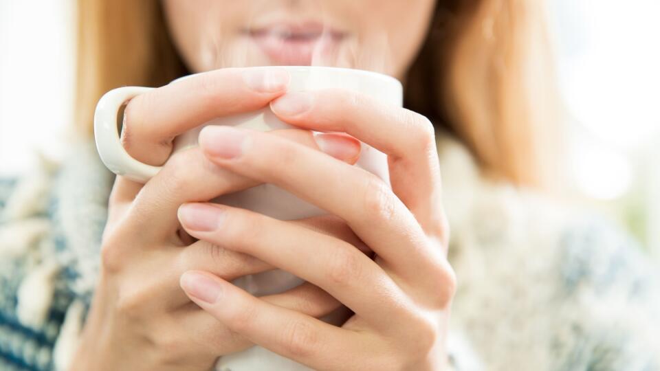 Woman drinking coffee.