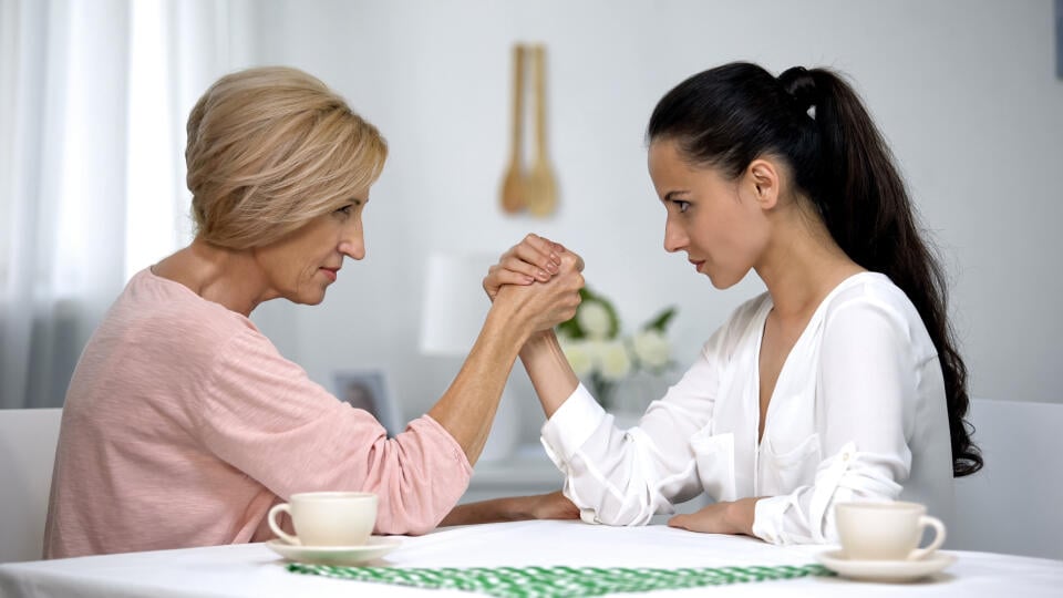 Mother,And,Daughter-in-law,Looking,On,Each,Other,During,Arm,Wrestling