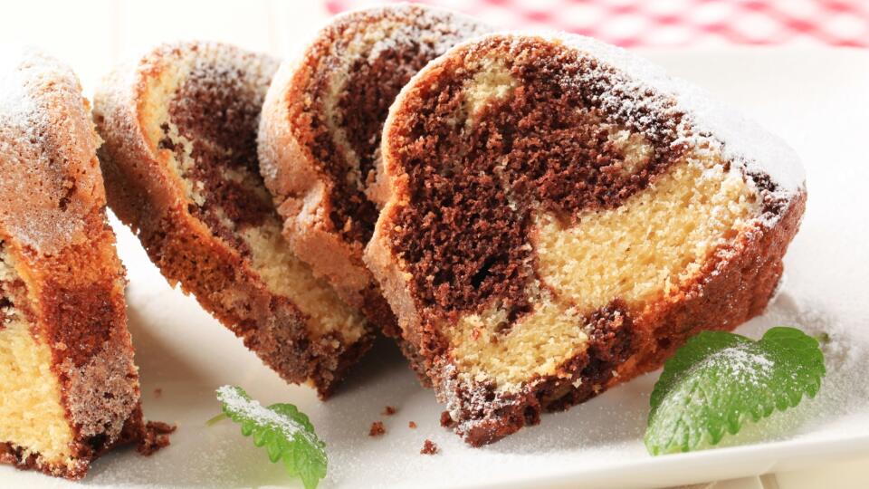 Slices of marble cake topped with powder sugar