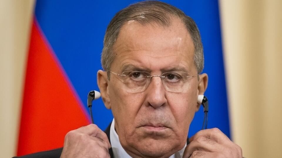 Russian Foreign Minister Sergey Lavrov removes headphones during a press conference with Italian Foreign Minister Angelino Alfano following their talks in Moscow, Russia, Thursday, Feb. 1, 2018. (AP Photo/Alexander Zemlianichenko)