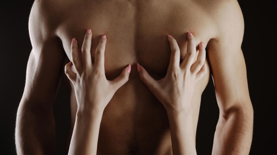 Close,Up,Of,Woman,Caressing,Her,Man's,Chest